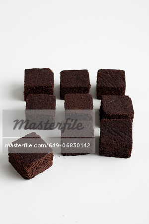 Nine chocolate brownies arranged in square