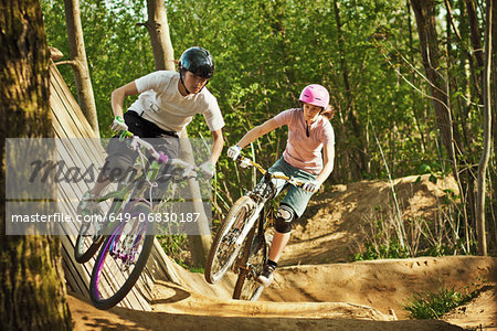 Cyclists riding on dirt bike course