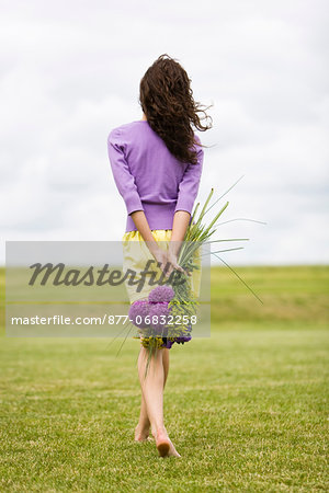 Young woman holding a bouquet of flowers