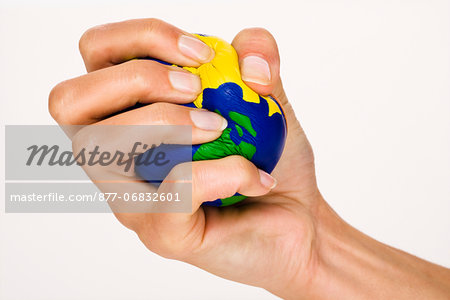 Woman's hand holding a little ball