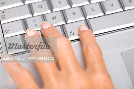 Woman's hand on a laptop