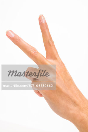 Woman's hand making peace sign