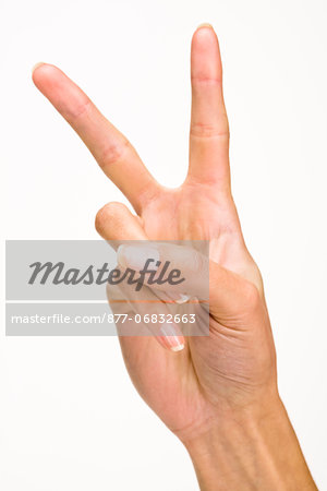 Woman's hands making peace sign