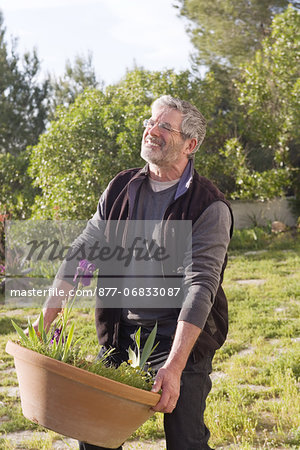 Man carrying flower pot
