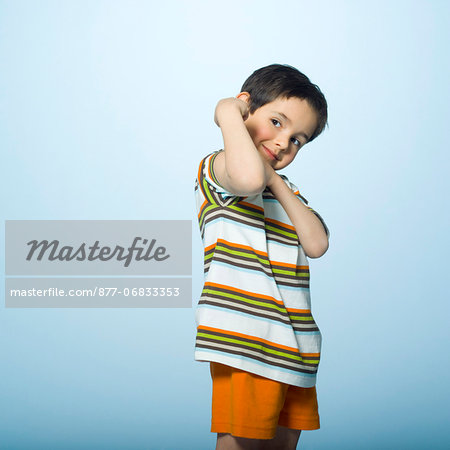 Little boy flexing muscles