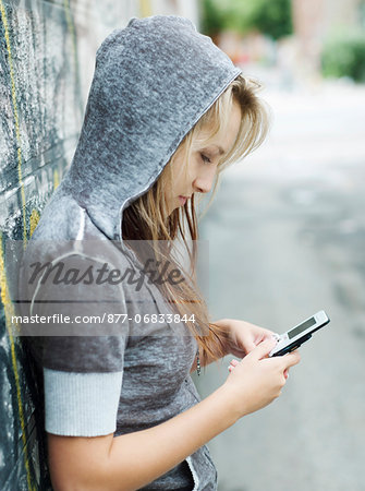 Teenage girl using mobile phone