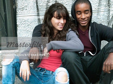 Teenagers sitting in the street