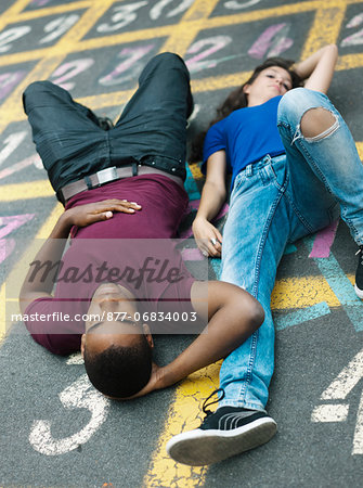 Teenagers lying on the floor