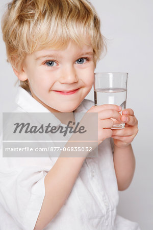 little boy glass of water