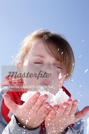 France, winter girl portrait blowing snow
