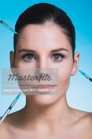 Young woman with syringes