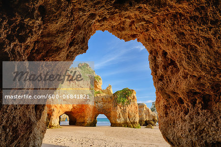 Natural Arch Rock Formations at Praia dos Tres Irmaos, Alvor, Portimao, Algarve, Portugal