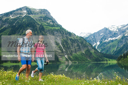 Mature couple hiking in mountains, Lake Vilsalpsee, Tannheim Valley, Austria