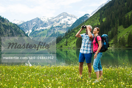 Mature couple hiking in mountains, Lake Vilsalpsee, Tannheim Valley, Austria