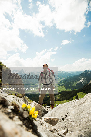 Mature man hiking in mountains, Tannheim Valley, Austria