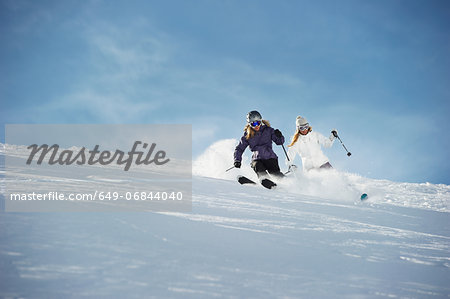 Two women skiing