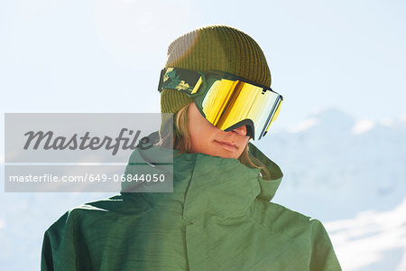 Portrait of a young male snowboarder