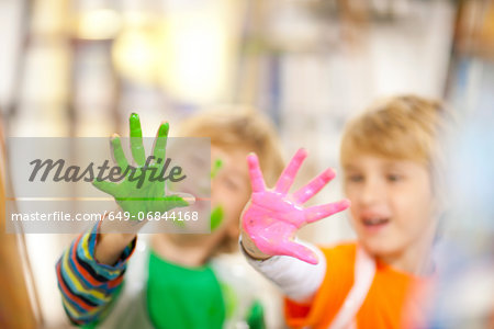 Boys with paint on their hands