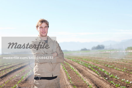 Young man in potato field, portrait