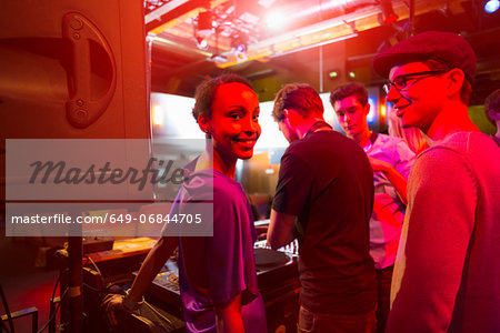 Group of people behind mixing desk