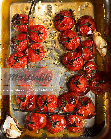 Roasted vine tomatoes in roasting tin
