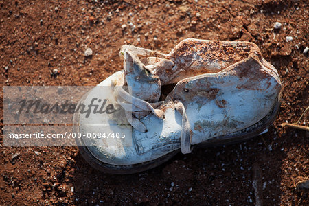 Close-Up of Baby Shoe in Aftermath of Tornado Damage, Moore, Oklahoma, USA.