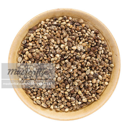 whole hemp seeds in a small bowl isolated on white, top view