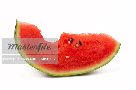 Bitten juicy watermelon portion isolated on white background, red fruit