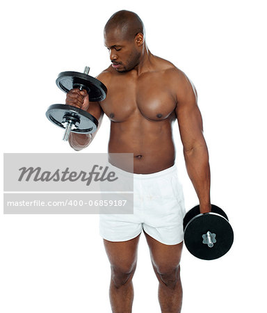 Young african man doing biceps exercise isolated at white background
