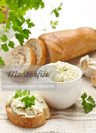bread with fresh cream cheese and parsley leaf