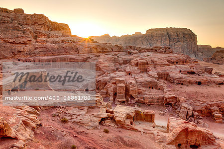 High view point of Petra tombs and amphitheater at sunset