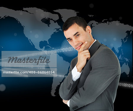 Businessman standing in front of a world map and binary code while smiling