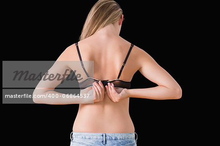 Woman opening her bra at her back