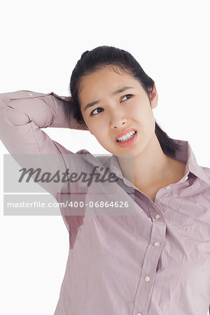 Embarassing woman with sweat patches looking away
