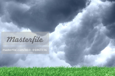 Dark grey clouds over green meadow