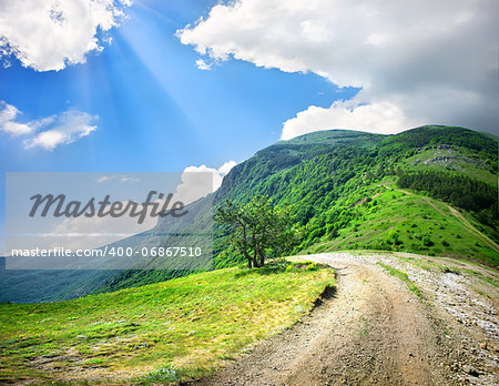 Country road in the mountains in the afternoon