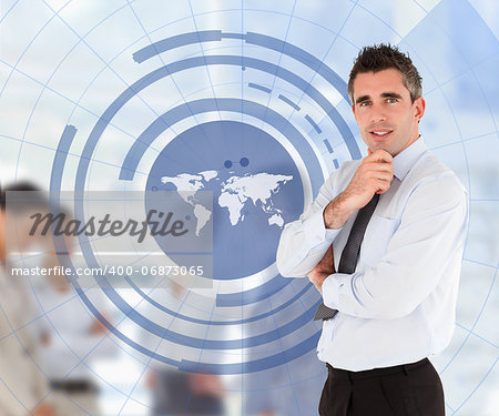 Businessman with arms crossed with a world map illustration and his colleagues in background