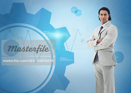 Businessman standing against a digital blue background
