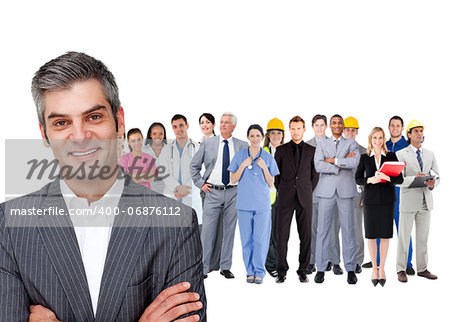 Smiling businessman ahead a group of people with different jobs on white background