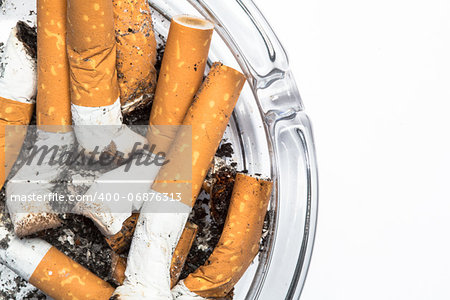 Close up overhead of ashtray on white background with copy space