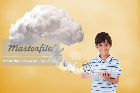 Cute boy using tablet to connect to cloud computing on yellow background