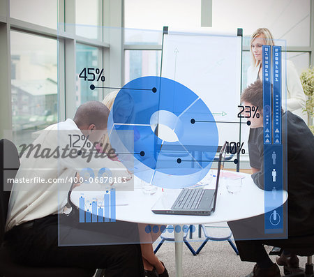 Business people using blue pie chart interface in a meeting