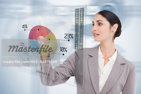 Businesswoman using colorful futuristic interface with her finger