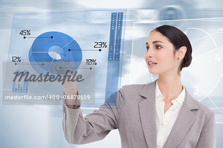 Businesswoman using colorful blue futuristic interface with her finger