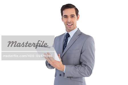 Happy businessman holding a tablet pc on white background