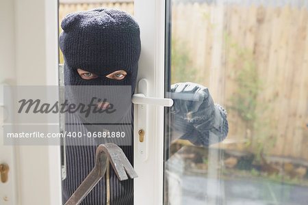 Burglar looking if someone is into the room