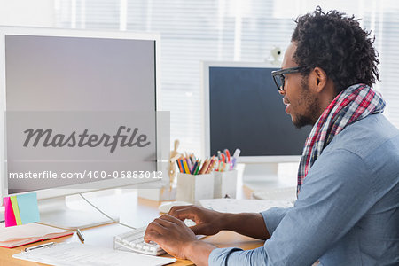 Creative business worker on computer in a modern office