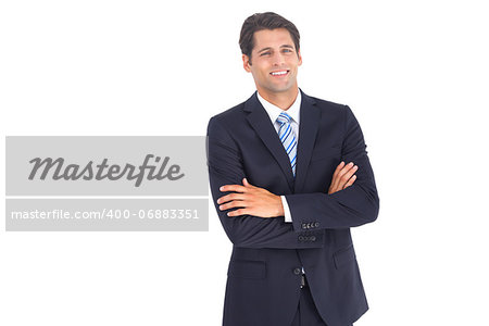 Smiling businessman looking at the camera with crossed arms