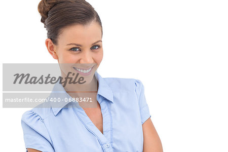 Smiling businesswoman looking at the camera on a white background