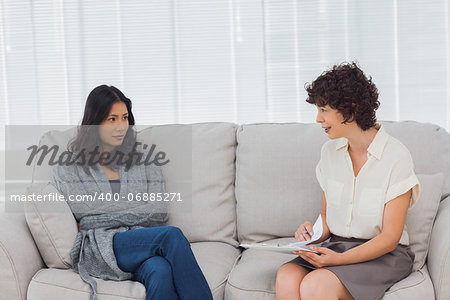 Therapist speaking to her depressed patient